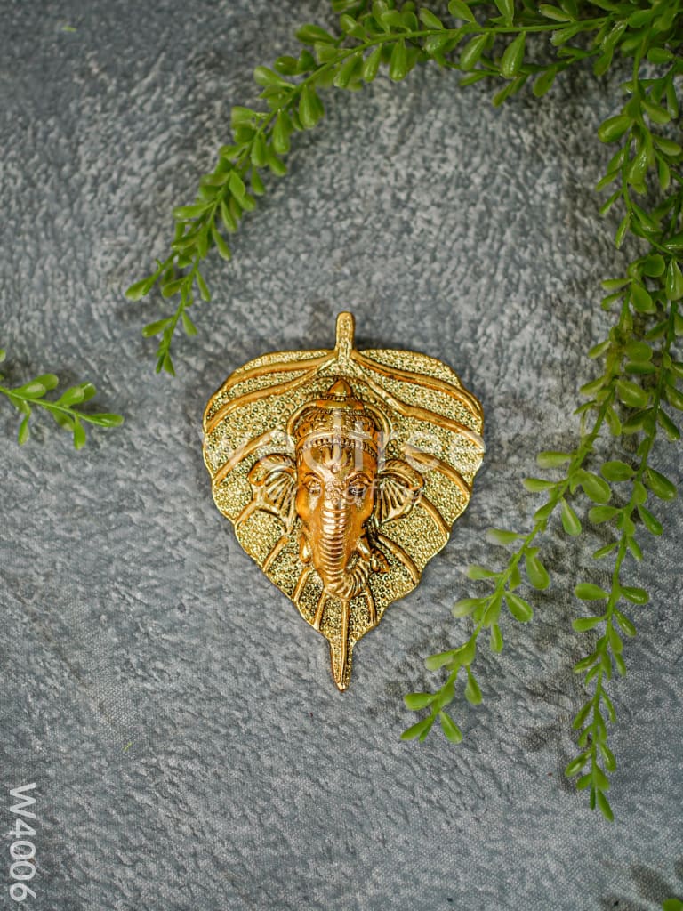 White Metal Wall Hanging Ganesha face on leaf - Gold Finish - W4006