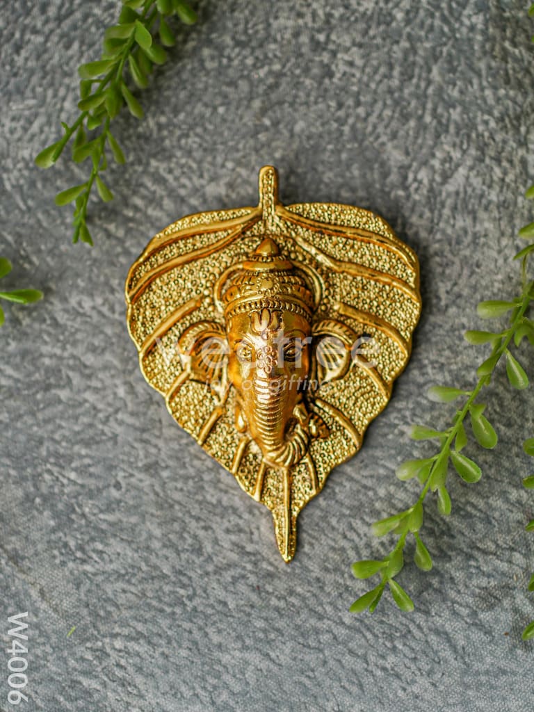 White Metal Wall Hanging Ganesha face on leaf - Gold Finish - W4006