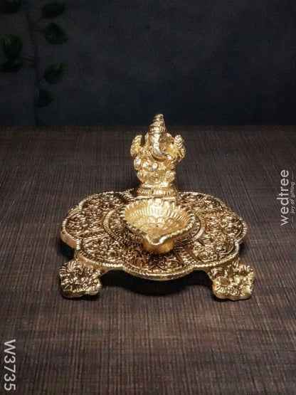 White Metal Chowki Ganesh With Diya Gold Finish - W3735 Diyas