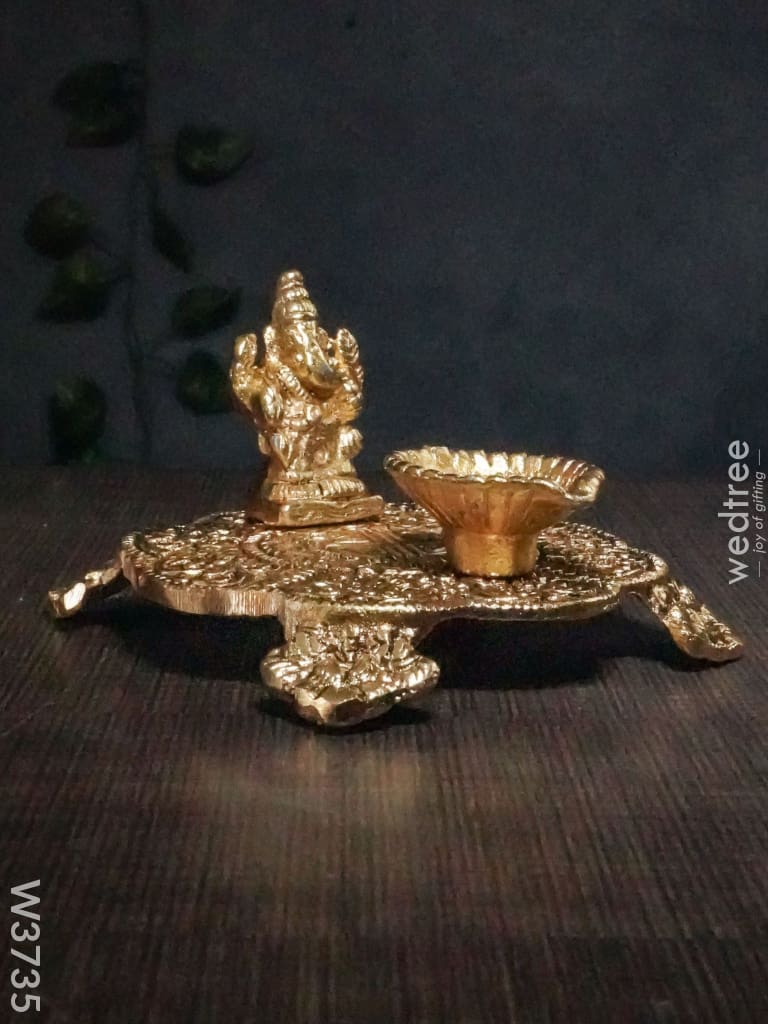 White Metal Chowki Ganesh With Diya Gold Finish - W3735 Diyas